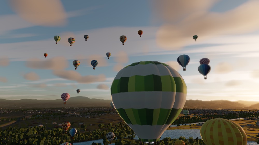Dozens of hot air balloons lifting off a valley floor as the sun comes up