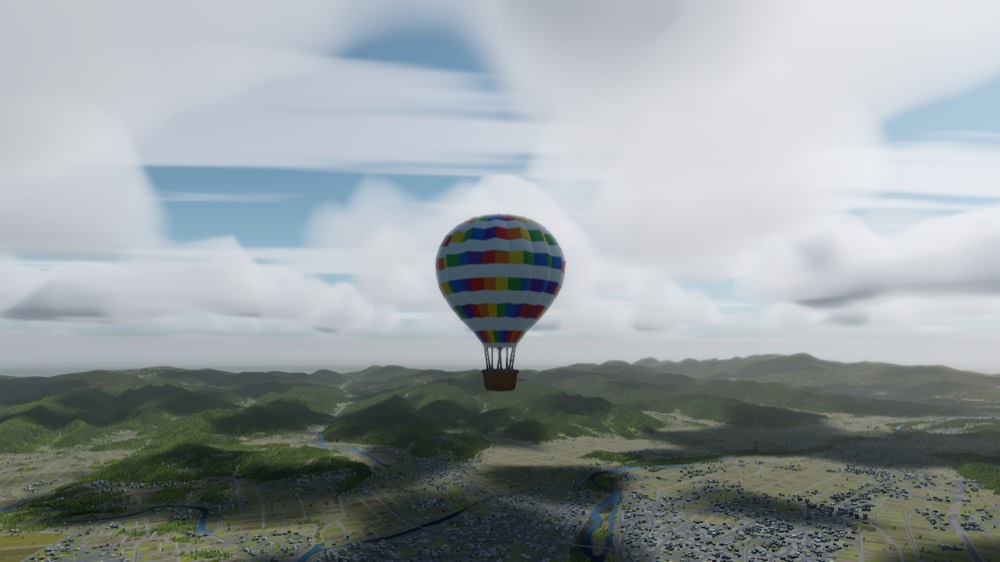 A balloon among fair-weather cumulus over low hills