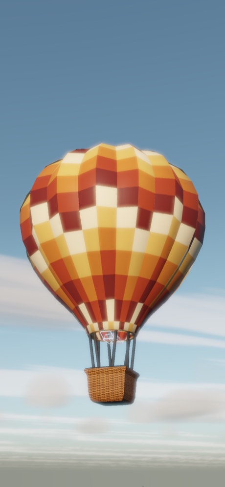 A red, orange and cream chequered balloon in a clear blue sky