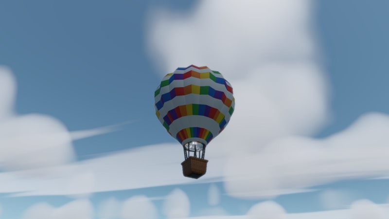 A brightly striped balloon against a blue sky with scattered cloud below